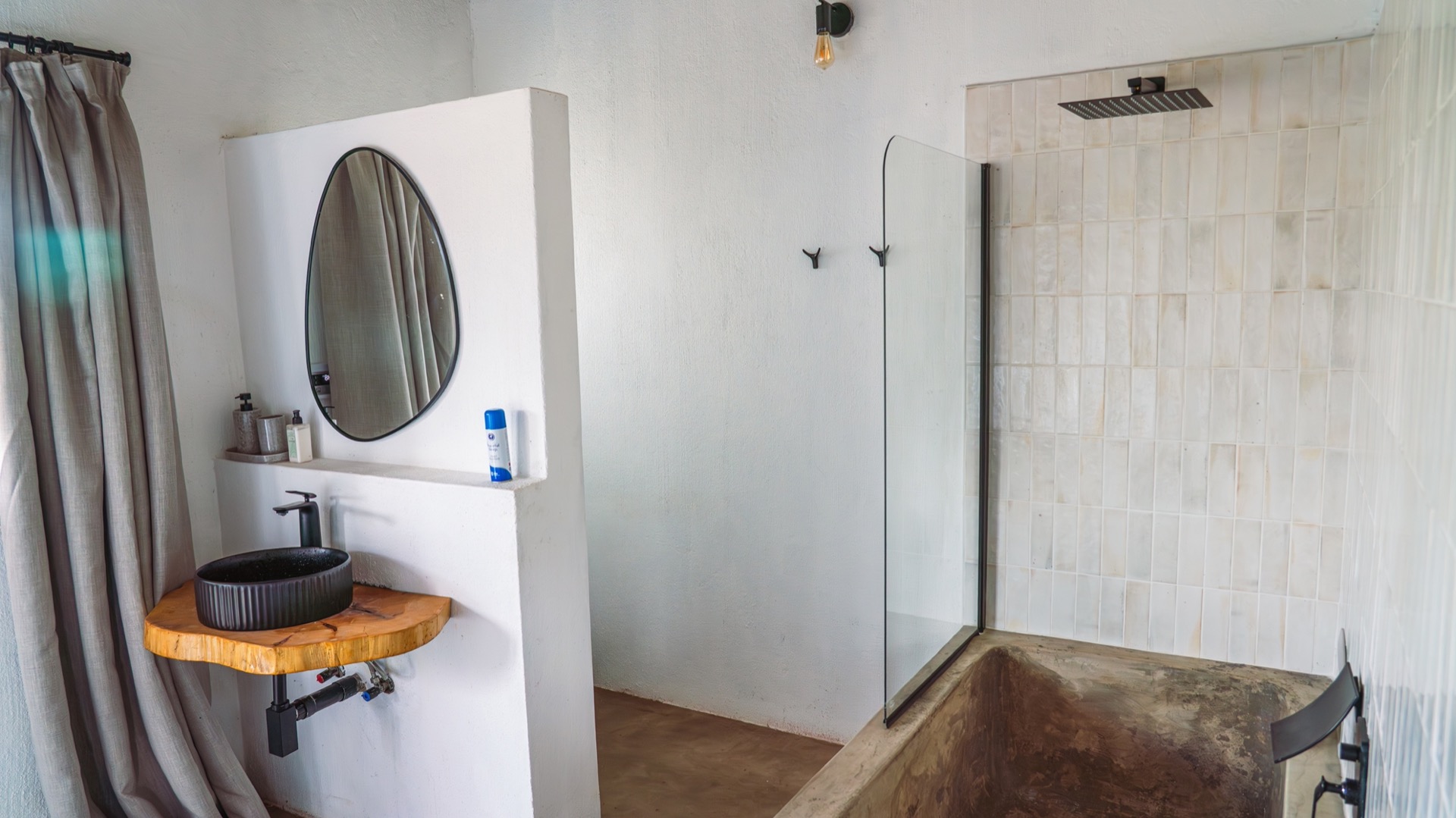 En-suite with a moulded stone tub and walk-in rain shower