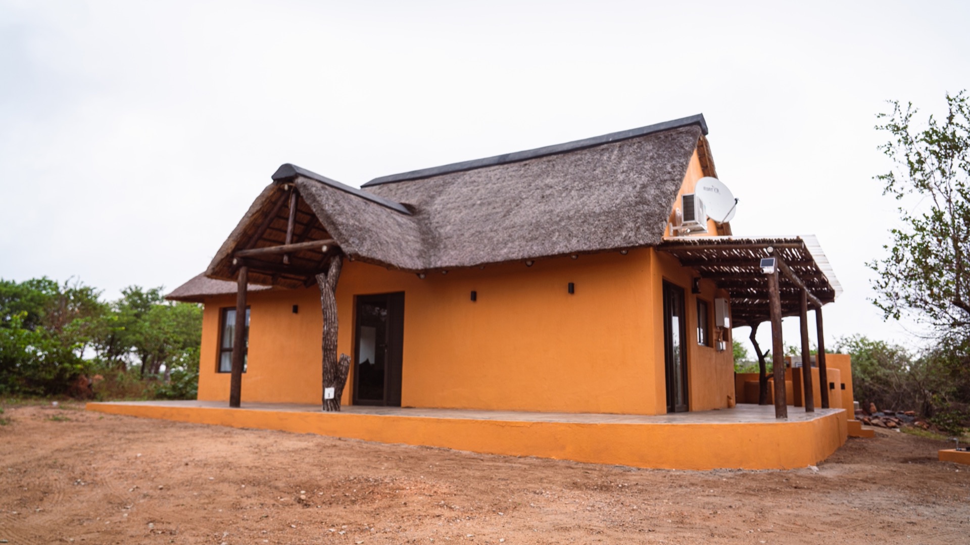 The full villa and patio seen from the side