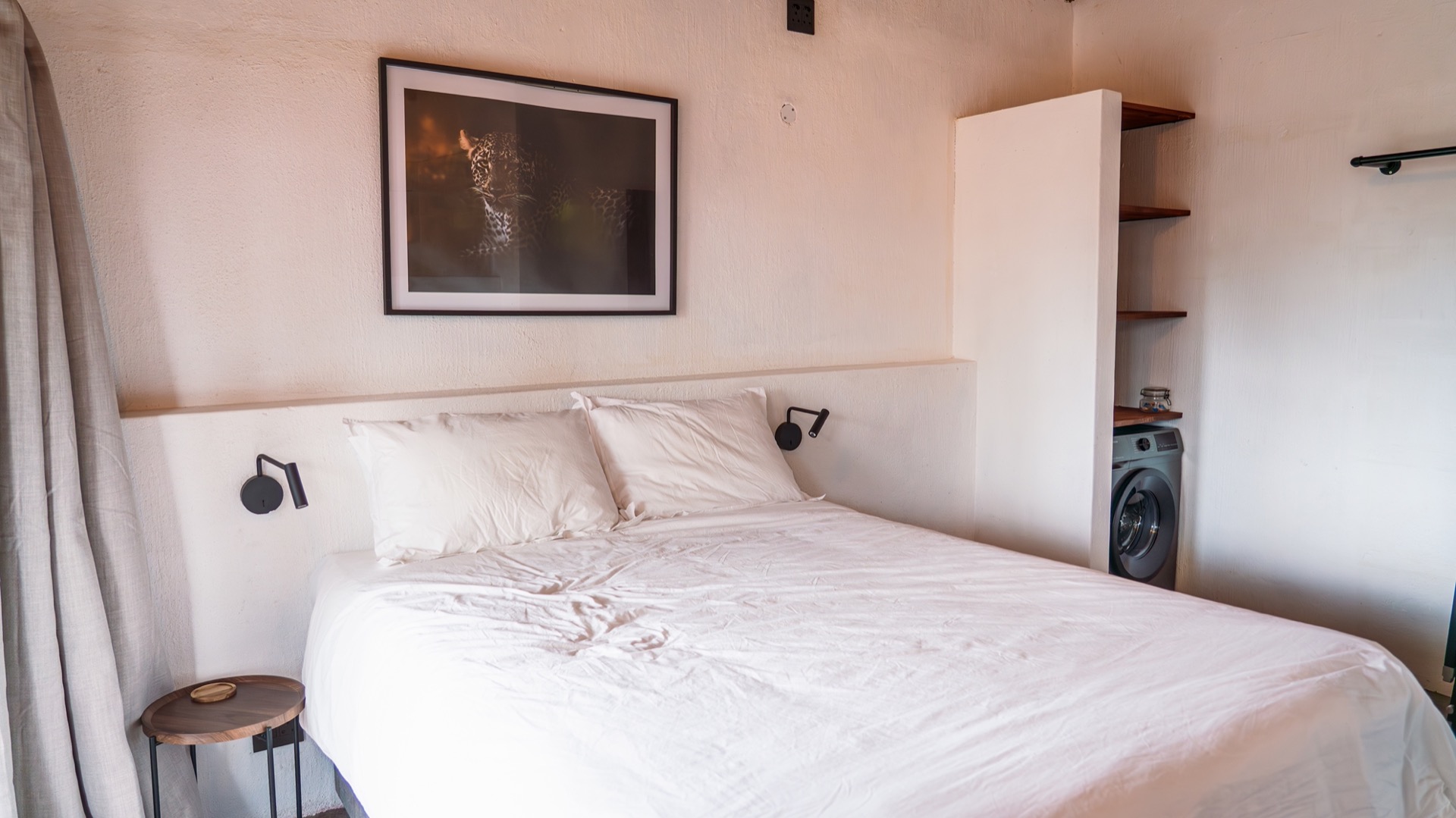 Second bedroom with a framed leopard print