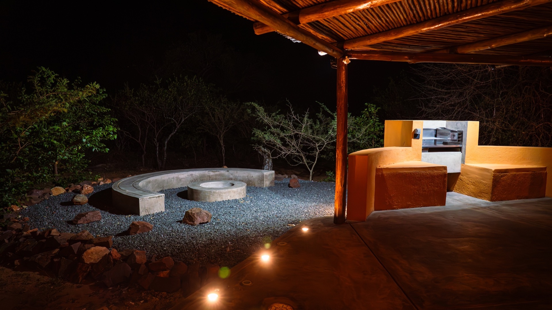 The boma and firepit beyond the braai at night